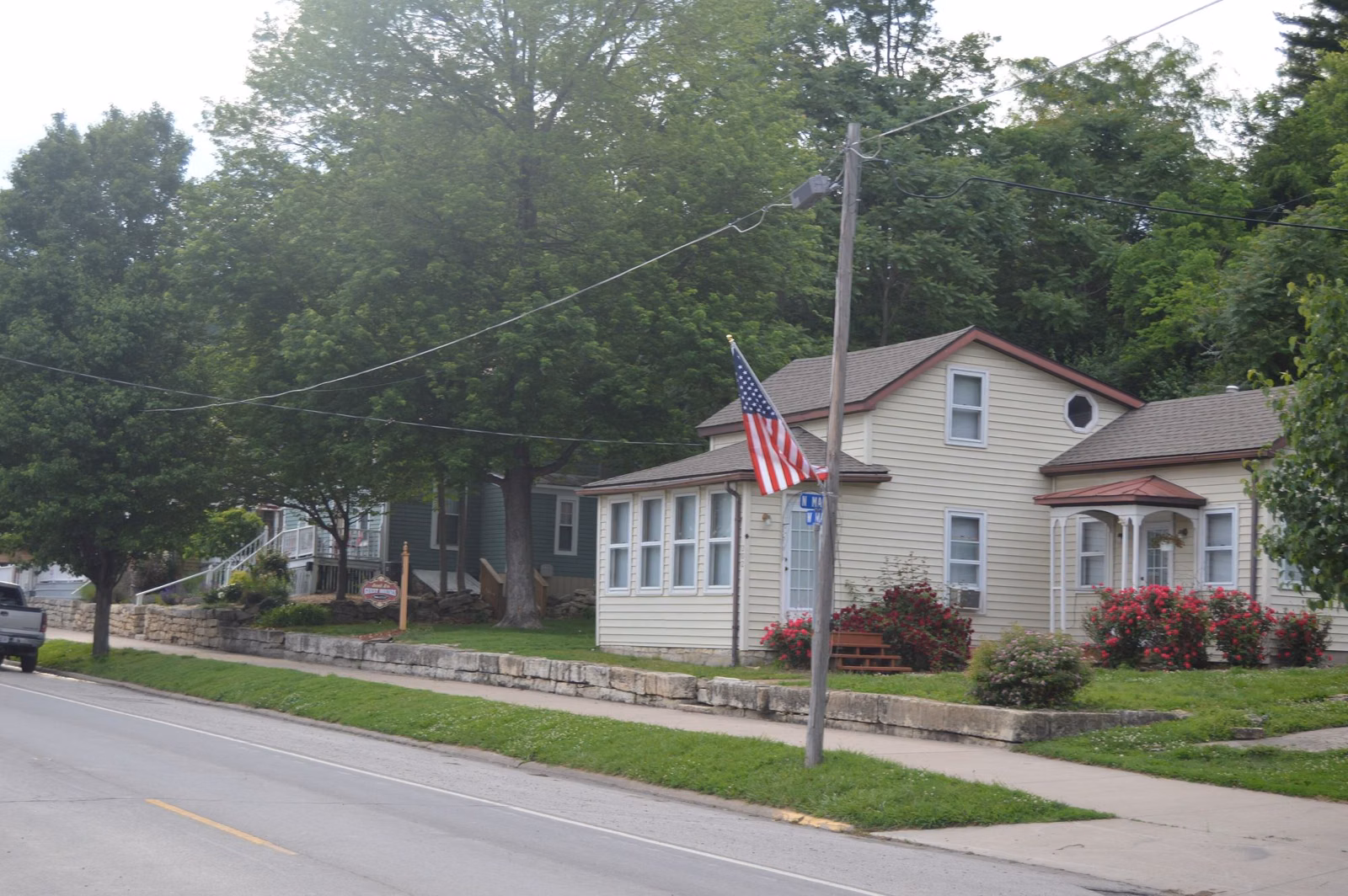 Houses along West Main Street (Route 100) in Grafton, Illinois, under big shade trees